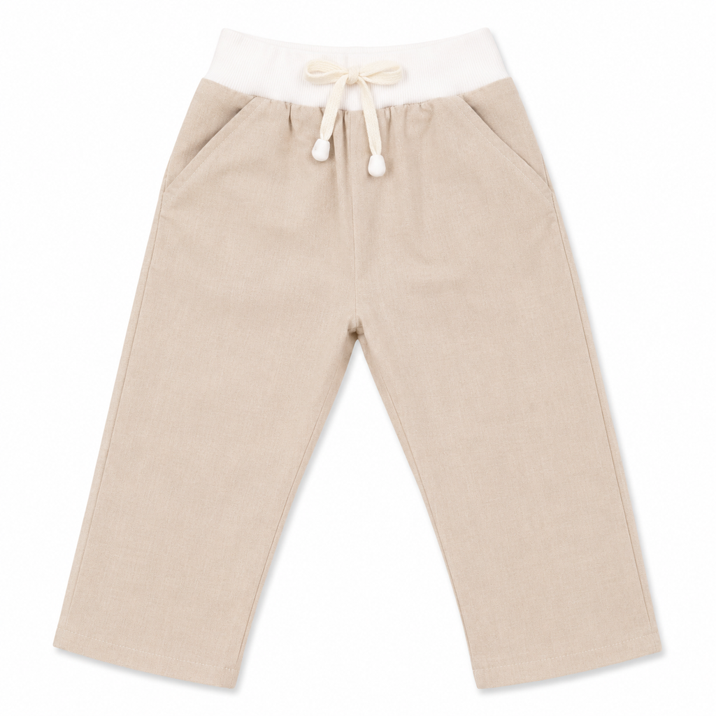A pair of beige children's pants with an elastic white waistband and a cream-colored drawstring tie, shown flat on a white background.