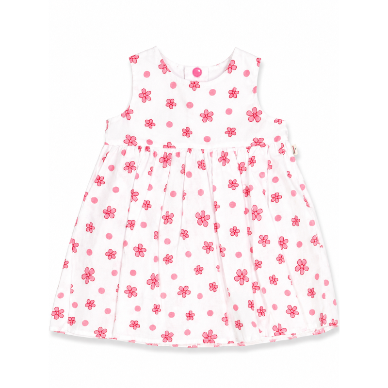 A sleeveless white baby dress with a pink polka dot pattern and small pink flower motifs, shown flat against a white background.